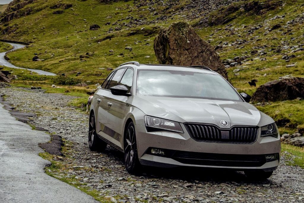 Grey Skoda Superb Estate parked on the side of the road