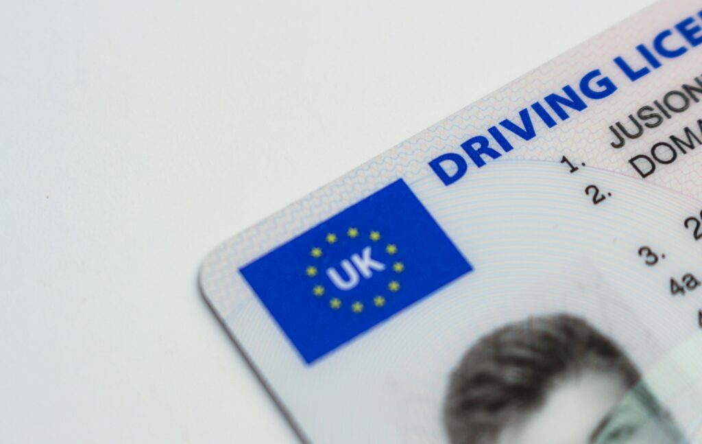 Close-up of UK driving licence on a white background