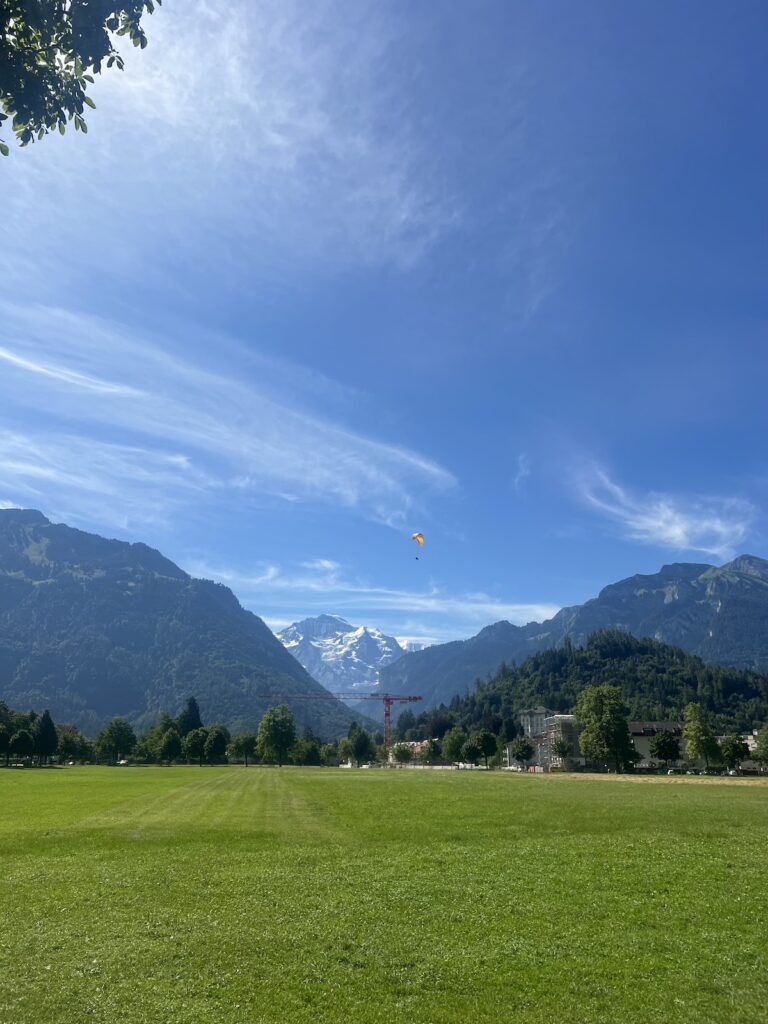 Image of a field in Switzerland with a mountain in the background - magical seven day road trip Switzerland