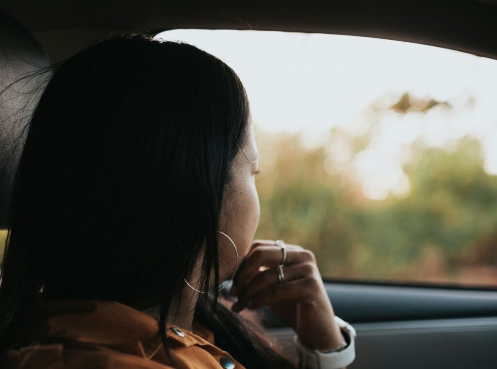 Passenger looking out of the car window