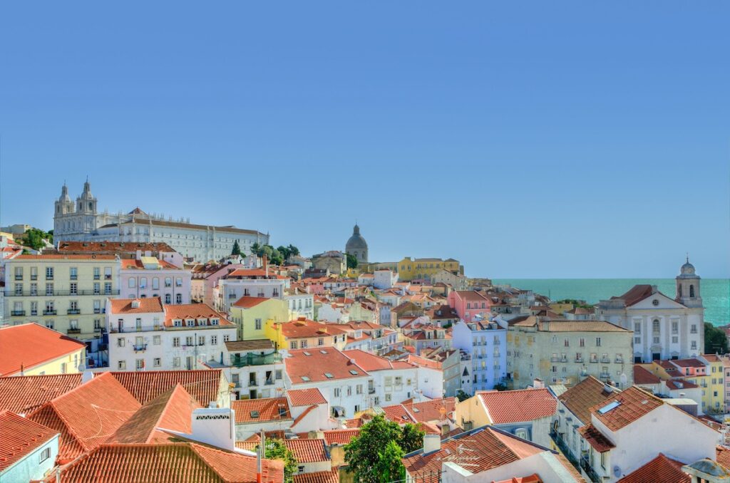 Image of buildings in Lisbon, Portugal with a clear blue sky 