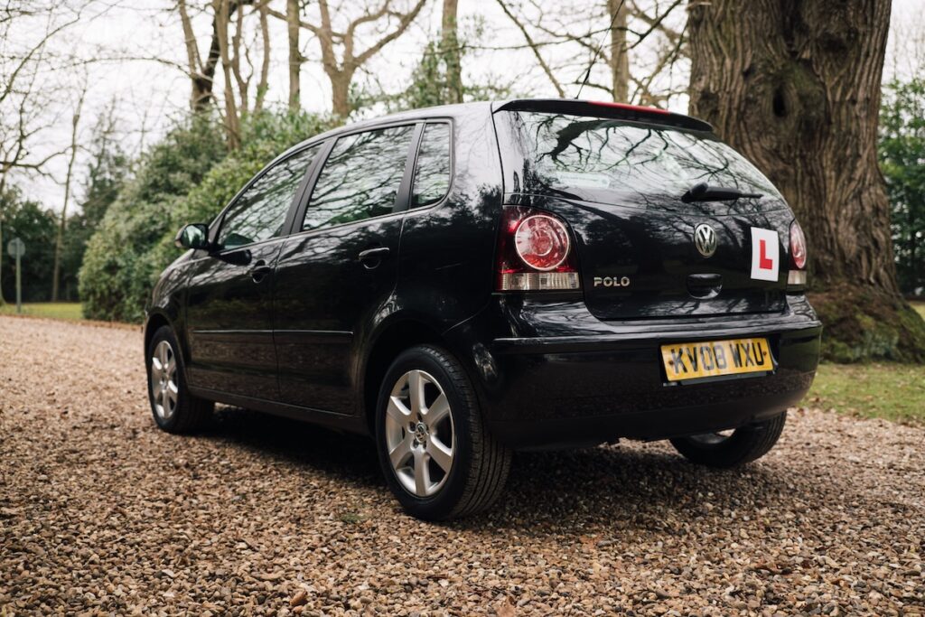 An image of the back of a VW Polo with an 'L' plate on the back