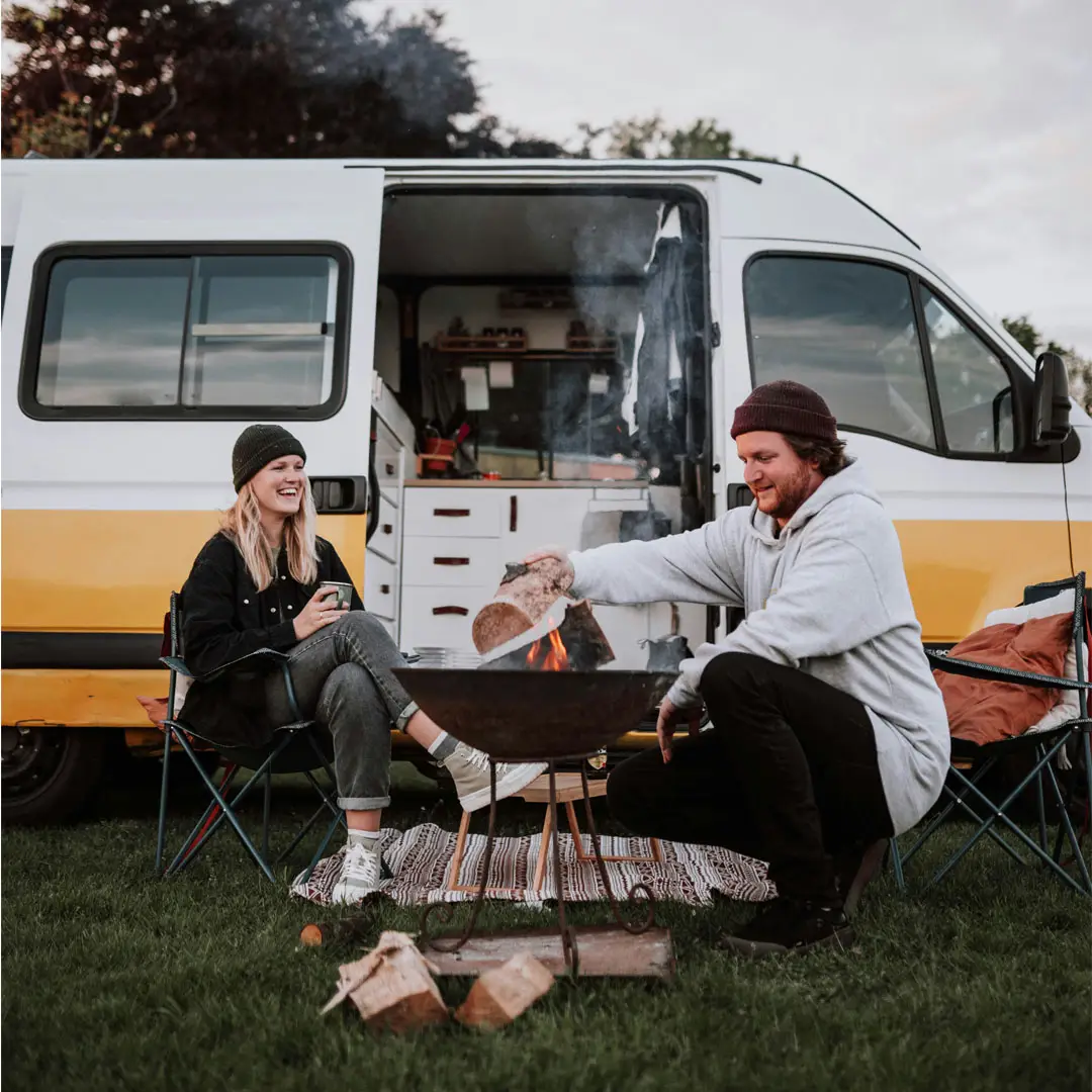 Couple Sitting outside of Motorhome
